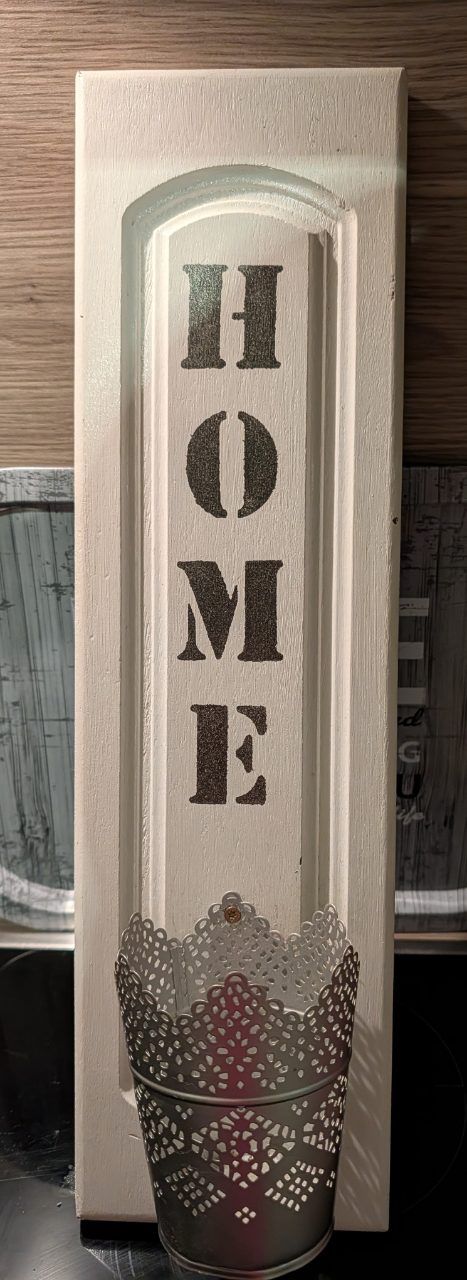 Schild mit Blumenhalter 