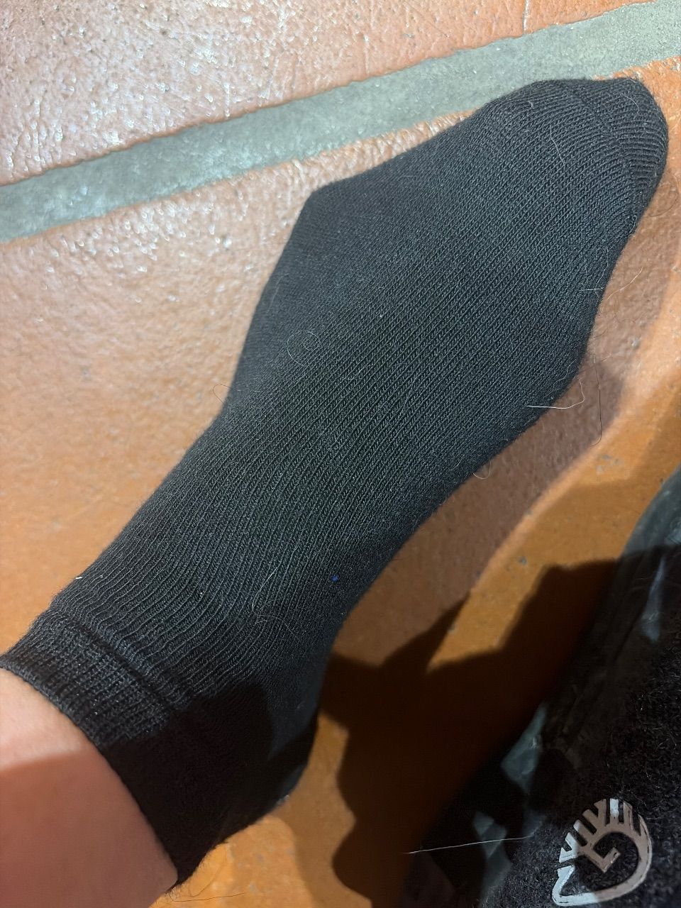 Schwarze getragene Socken Size L